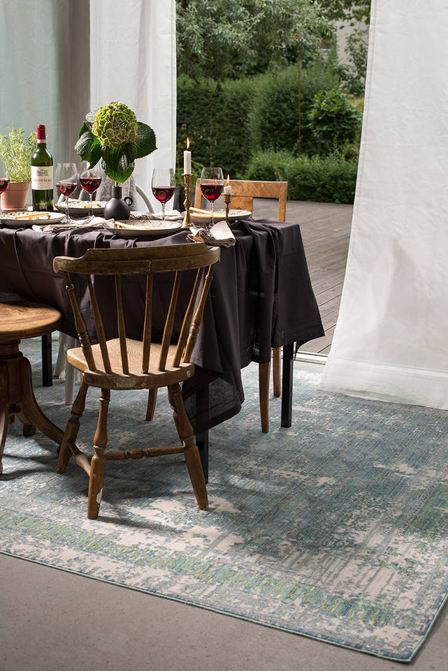 Blue  aqua silk -  Carpet in a dining area.