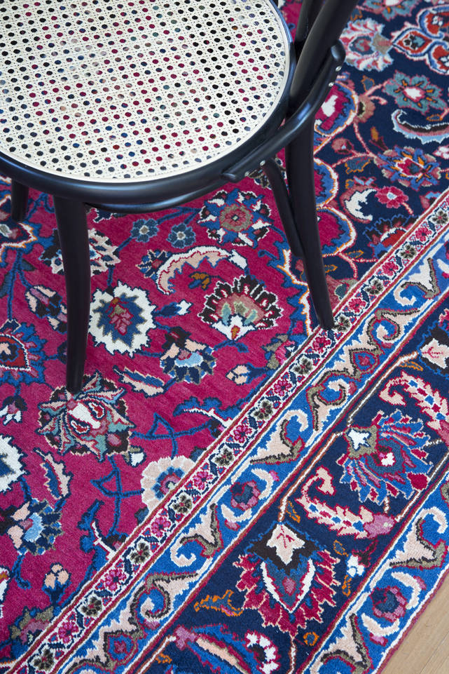 Red  mashad -  Carpet in a dining area.