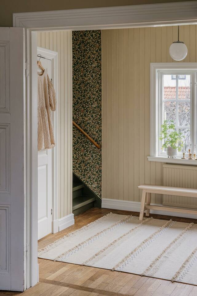 White  cotton dhurrie -  Carpet in a hallway.