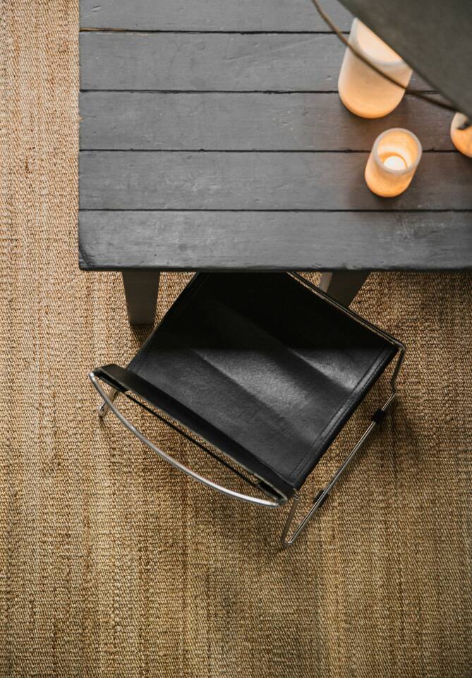 White  jute -  Carpet in a dining area.