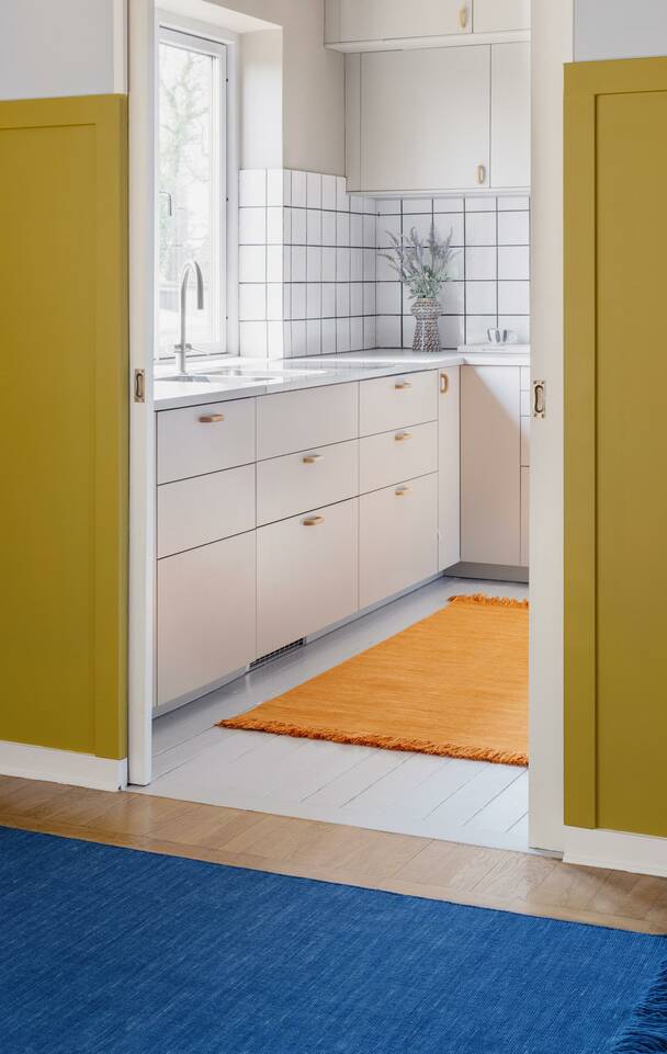 Brown / yellow  kilim dhorri -  Carpet in a kitchen.