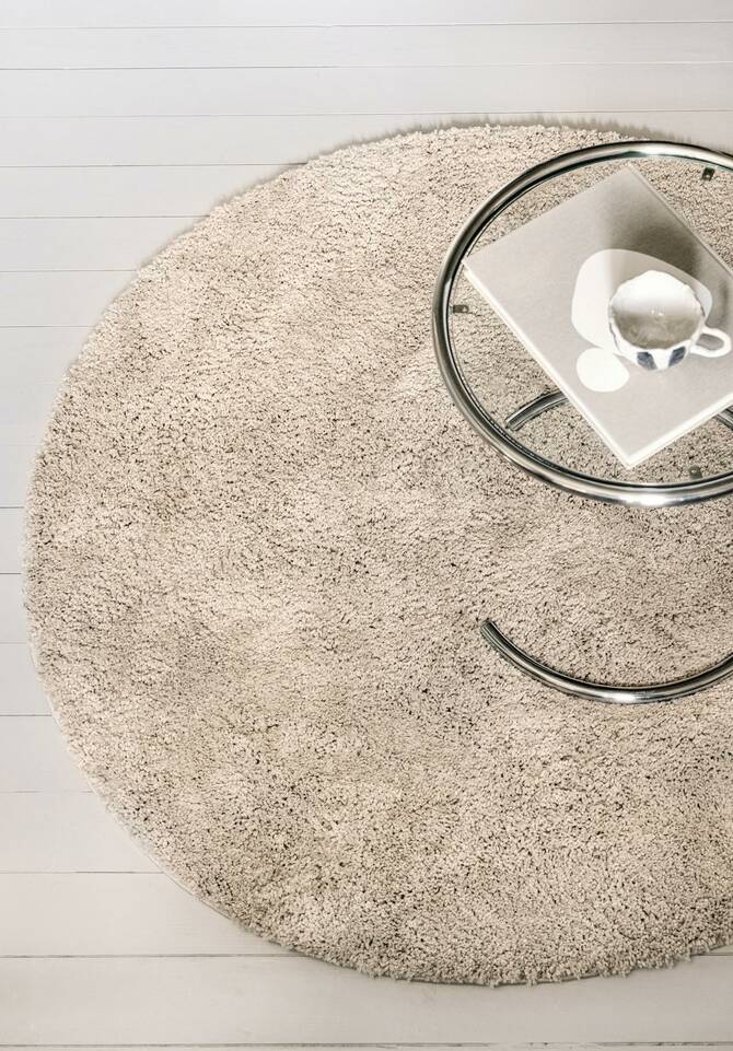 White round kids carpet -   in a living room.