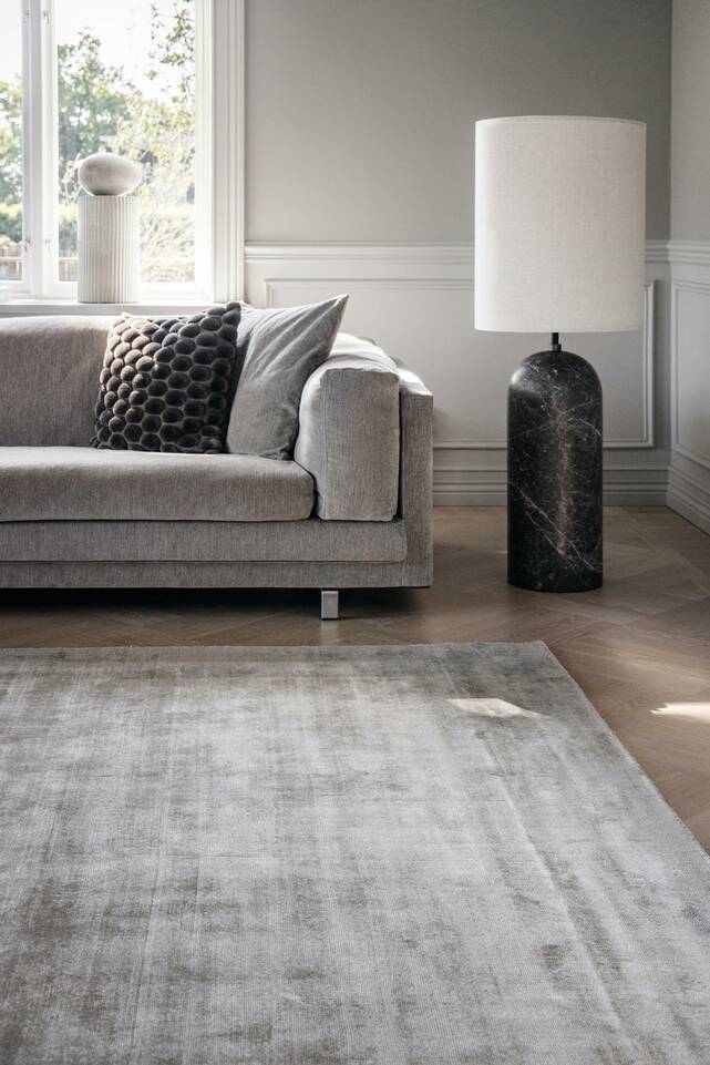 Black / grey  handloom tip share -  Carpet in a living room.