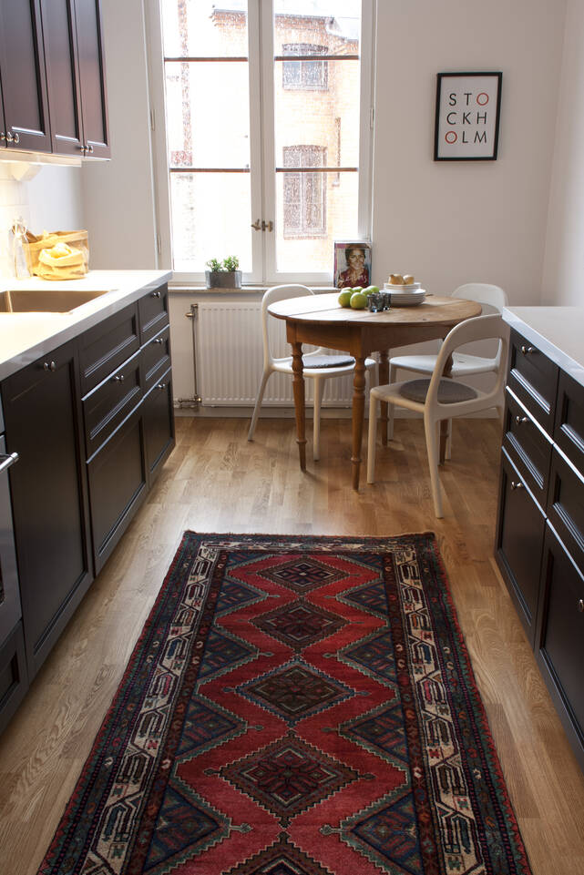 Red  hamadan -  Carpet in a kitchen.